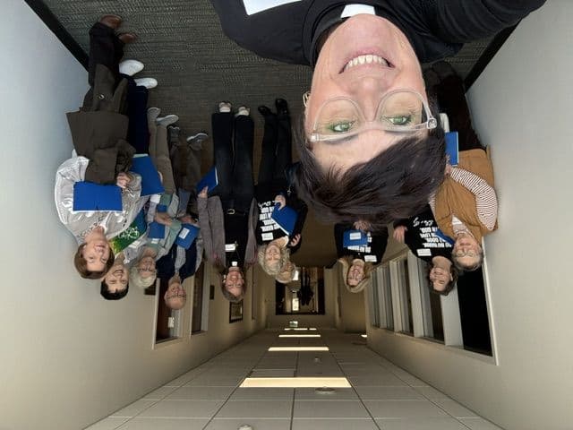Monica and supporters taking a selfie in the state capitol hallway
