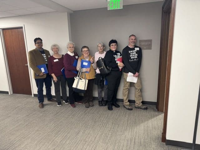 Monica's advocacy group gathered in the state capitol hallway