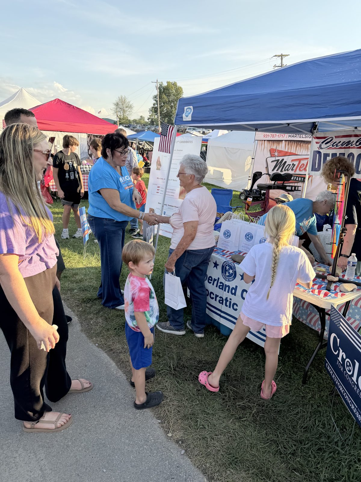 Fairgoers visiting the Democratic Party booth at the Cumberland County Fair