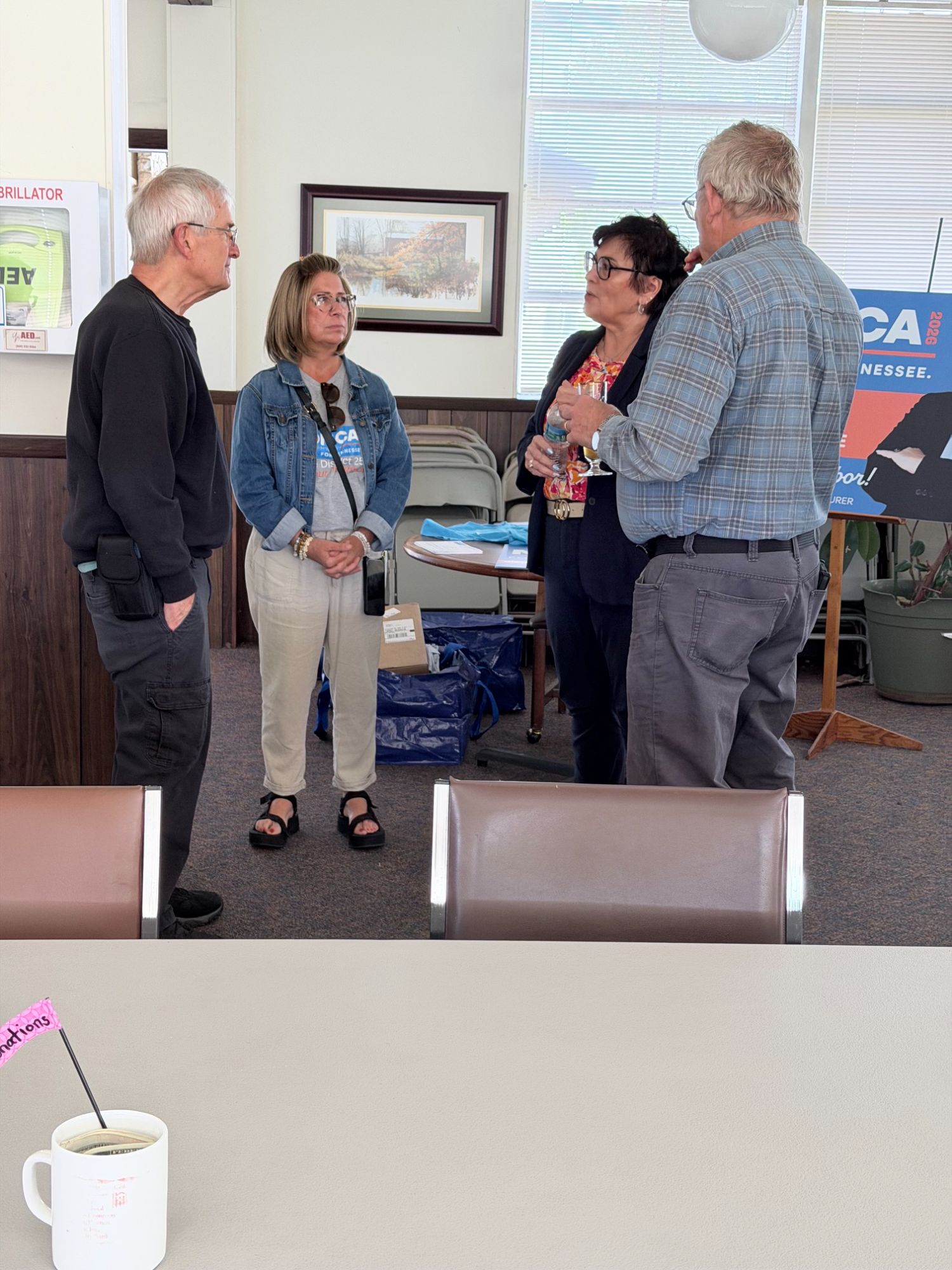 Monica listening as supporters share their thoughts at a District 25 meet and greet