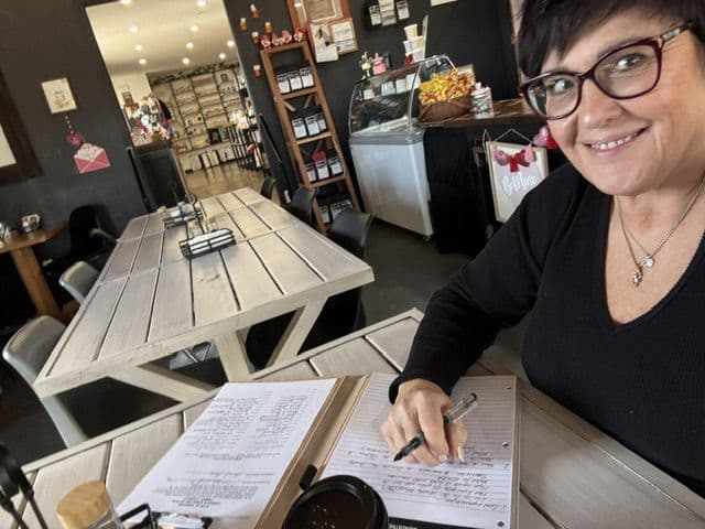 Monica working on campaign plans at a local cafe