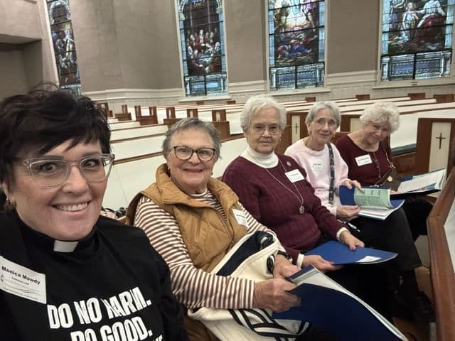 Monica Mowdy with church community members