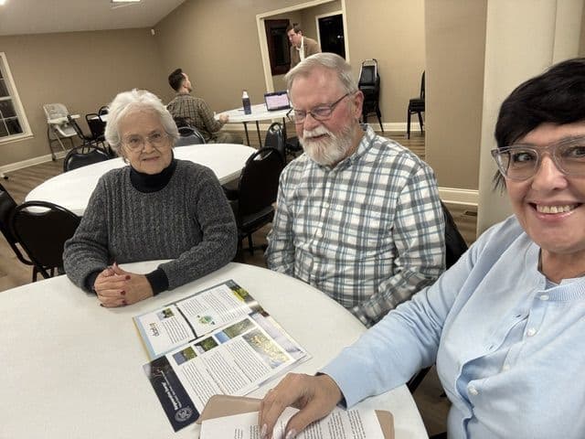 Monica meeting with community members at a local gathering